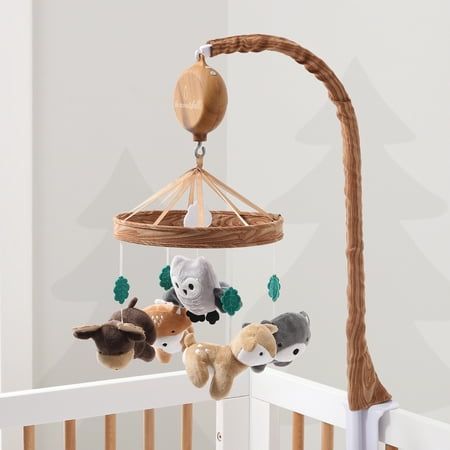 Whimsical Woodland Musical Mobile by The Peanutshell helps to promote baby's auditory development, motor skills and visual stimulation. Our thoughtfully designed nursery essential features a soft velour bear, deer, owl, moose and fox surrounded by green felt leaves and central white cloud. A faux woodgrain printed ring construction adds extra forest flair to your nursery. The digital music box plays snippets of 12 different lullabies to sooth your little one gently to sleep. Easily switch music Natural Baby Room, Woodland Creatures Nursery, Printed Ring, Woodland Crib, Forest Animal Nursery, Animal Nursery Theme, Owl Nursery, Whimsical Woodland, Woodland Animal Nursery