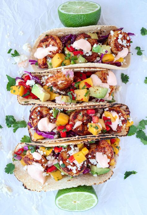 Shrimp Tacos with Mango Salsa are a super flavorful and satisfying meal that is perfect for spring and summer months. The seasoned shrimp is topped with refreshing mango salsa and drizzled with THE BEST creamy and spicy sauce for a perfectly balanced meal that will surely become a family favorite! Blackened Shrimp Tacos With Mango Salsa, Shrimp Tacos With Mango Slaw, Mango Salsa Shrimp Tacos, Shrimp Tacos Mango Salsa, Mango Shrimp Tacos, Shrimp Tacos With Mango Salsa, Mango Tacos, College Dinner, Shrimp Burrito