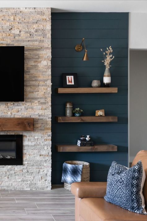 This gorgeous saturated blue/green hue is exactly what this space needed to both modernize the paneling on the focal wall as well as create repetition throughout this client home. Visit our blog to see how the rest turned out! Dark Accent Wall Living Room, Wall Niches Ideas, Blue Accent Wall Living Room, Niches Ideas, Blue Feature Wall, Wall Niches, Fireplace Accent Walls, Teal Accent Walls, Fireplace Feature Wall