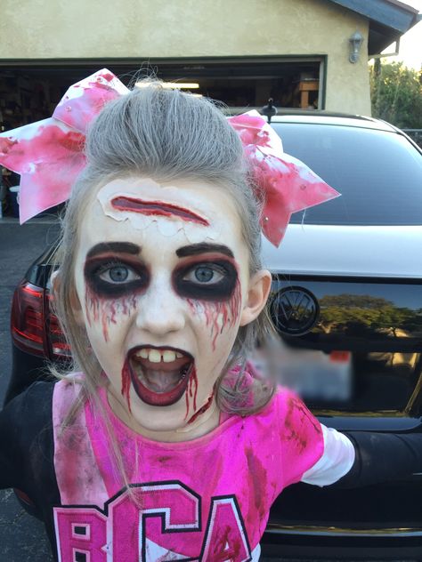 Zombie Cheerleader makeup!! Cheerleader Zombie Makeup, Cheerleader Makeup Halloween, Scary Cheerleader Makeup, Zombie Make Up For Kids, Zombie Kids Makeup, Creepy Cheerleader Makeup, Zombie Cheerleader Costume Makeup, Zombie Cheerleader Makeup For Kids, Kid Zombie Makeup