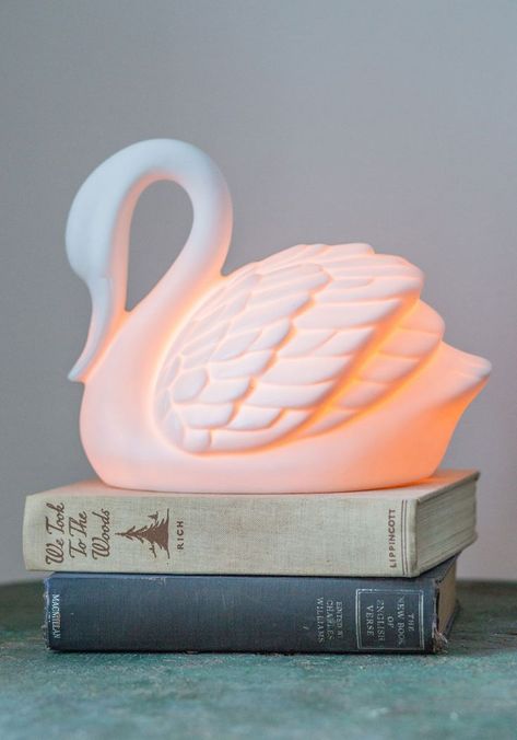 Swans in a Lifetime Lamp. As an interior decorator with an elegant aesthetic, youve seen your fair share of delightful decor, yet no piece has looked as lovely as this ivory swan lamp from Streamline! #white #wedding #modcloth Swan Lamp, Swan Pool Float, Swan Nursery, Swan Decor, White Swan, Big Girl Rooms, Kids Lighting, Decor Nursery, Swans