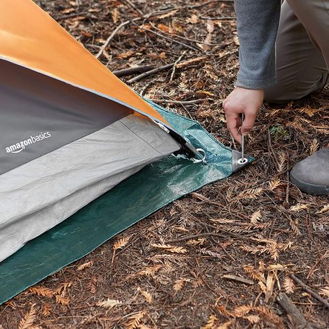 Amazon Basics Waterproof Camping Tarp Multi-purpose outdoor tarp is great for covering items or placement under a camping tent Waterproof design made of durable rip-stop fabric with polyethylene lamination on both sides Waterproof design made of durable rip-stop fabric with polyethylene lamination on both sides Reinforced corners and edges for long-lasting strength Dimensions: 8 ft X 10 ft Must Have Camping Gear, Camping Gear Survival, Camping Rug, Camping Tarp, Camping In The Rain, Waterproof Tent, Tent Campers, Tent Tarp, Amazon Basics