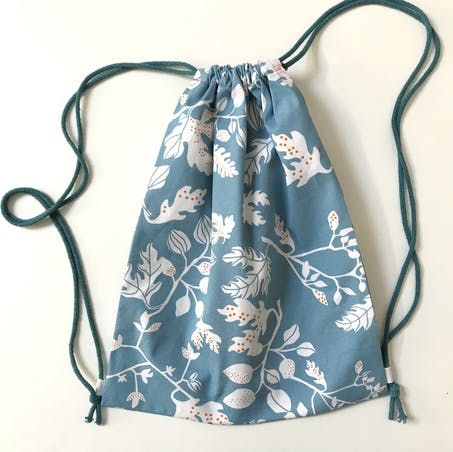 Make a drawstring bag with no tricky fastenings! | LoveCrafts Drawstring Backpack Pattern, Wool Blanket Upcycle, Crochet Totes, Drawstring Bag Diy, Drawstring Bag Tutorials, Drawstring Bag Pattern, Teaching Sewing, Sewing Circles, Diy Backpack