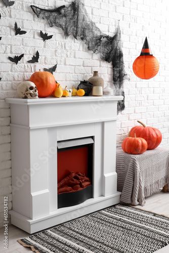 Stock Image: Interior of living room decorated for Halloween with fireplace, pumpkins and paper bats Interior Of Living Room, Paper Bats, Halloween Fireplace, Paper Bat, Adobe Stock, Pumpkins, Bat, Fireplace, Room Decor