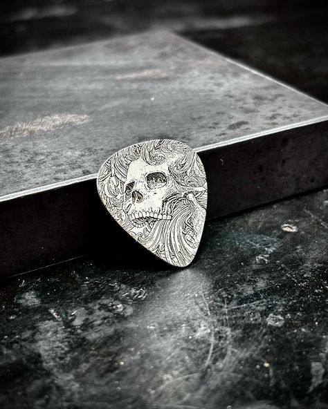 The ghoulish strummer Another guitar pick from yesterday’s batch. Made out of 20g spring hard .925 sterling silver . . . . . . . . #guitarpick #silver #sterlingsilver #ghoulish #guitarist #guitar #skull #personalized #customguitarpicks #musician #gift #giftidea #giftideas #sooke #sookebc Cool Guitar Picks, Silver Guitar, Guitar Picks Personalized, Custom Guitar Picks, Steel Guitar, Skull Fashion, Guitar Picks, Silver Engraving, Cool Guitar