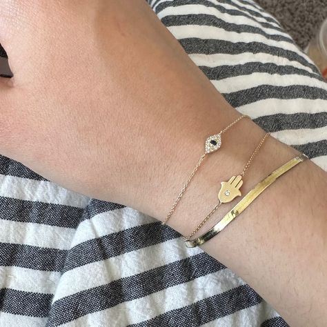 Hamsa evil eye gold herringbone bracelet stack aesthetic minimalist simple jewlery Elegant Gold Evil Eye Bracelet, Elegant Gold Plated Evil Eye Bracelet, Hamsa Bracelet Evil Eye, Hamsa Hand Evil Eye Bracelet, Hamsa Bracelet Gold, Gold Bracelets Stacked, Wrist Stacks, Hamsa Bracelet, Stacked Jewelry