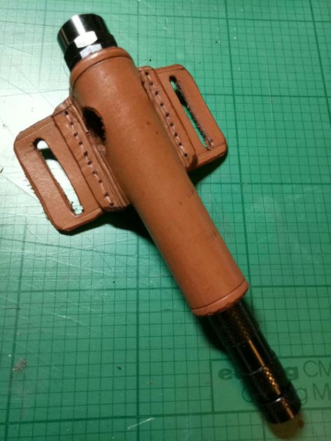 Flashlight holster. Lght can be inserted through holes in the tube to allow for hands free use. Leather Flashlight Holster, Flashlight Holster, Holster Pattern, Hide Tanning, Leather Holster Pattern, Buck 110, Karambit Knife, Leather Craft Tools, Survival Camping