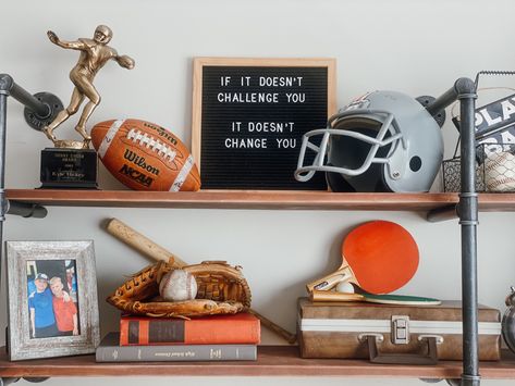 Tv Sports Room, Sports Theme Bedroom, Vintage Baseball Decor, Boys Bedroom Orange, Baseball Basement, Football Themed Room, Vintage Sports Nursery, Vintage Sports Decor, Sports Room Boys