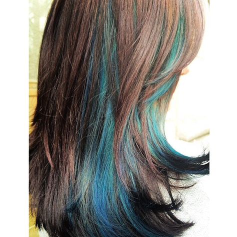 Beautiful brown haircolor with turquoise highlights. Love this look. Brown Hair With Unnatural Highlights, Brown Teal Hair, Aqua Peekaboo Hair, Brown Hair Teal Highlights, Blue Streaks Curly Hair, Brown And Aqua Hair, Brown Hair With Turquoise Highlights, Teal Streaks In Brown Hair, Brown And Turquoise Hair