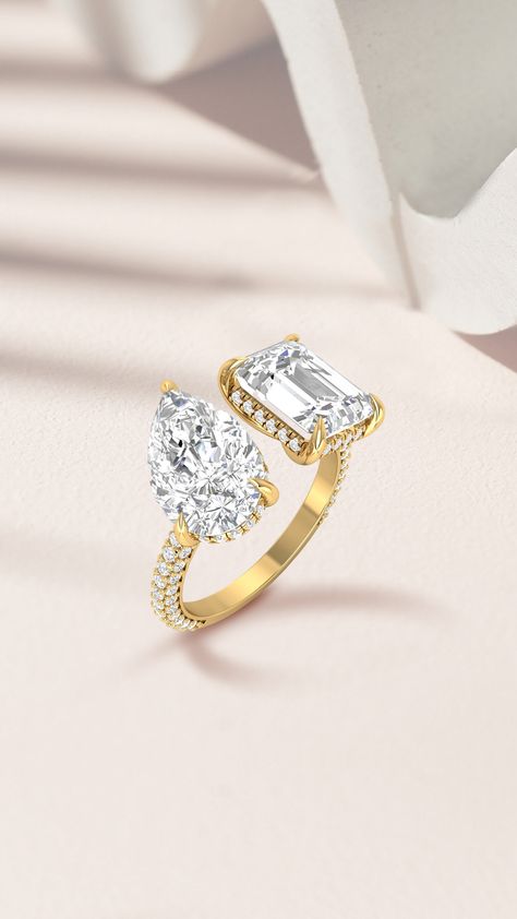 When you can't decide on just one shape, you go for a Toi et Moi ring! 💍 The two stones in this ring represent the union of two hearts. Would you choose a Toi et Moi ring as your engagement ring?❤️  #pearcut #emeraldcut #weddingring #pearcutdiamondring #emeraldcutring #twostonering #doublediamondring #yellowgoldring #deediamonds Two Stone Diamond Ring, Double Diamond Ring, Pear Cut Diamond Ring, Bridal Jewellery Inspiration, Stone Diamond Ring, Diamond Pendant Sets, Solitaire Rings, Designer Bracelets, Elegant Engagement Rings