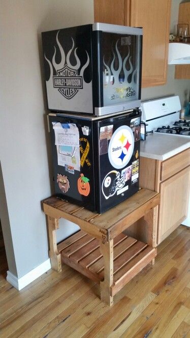 Mini fridge stand out of a skid. Painting A Mini Fridge, Small Fridge Stand, Cool Mini Fridge In Bedroom, Stand For Mini Fridge, Mini Fridge Stand Ideas, Garage Mini Fridge, Mini Fridge Stand Diy, Diy Mini Fridge, Mini Fridge Table