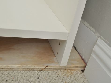 Raising the bookcase with a plywood base gives support on the carpet and makes it the right height for the baseboard trim Built In On Carpet, Billy Ikea, Billy Bookcase Hack, Baseboard Trim, Ikea Billy Bookcase, Ikea Billy, Billy Bookcase, Bookcase Wall, Wood Bookcase