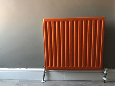 Orange radiator - painted with Rust-Oleum All-Surface Paint (Sunset Orange). Process was one coat, sand, followed by second coat to get a nice even finish. Applied by brush. The walls are Colour Courage 'Shore Rocks' (available in B&Q) and skirting done in Rust-Oleum 'Chalk White' furniture paint. Radiator Paint Ideas, Orange Radiator, Bedroom Radiators, Paint Sunset, Brown Walls Living Room, Hostel Room, Orange Paint, Sunset Orange, Rust Oleum