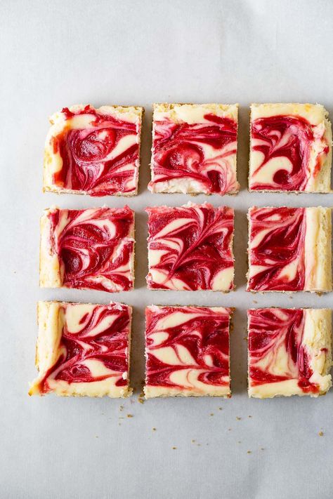 Swirled raspberry lemon cheesecake bars are dense and creamy with a hint of lemon. The raspberry swirl on top adds just the perfect touch of sweet tartness.#cheesecake#raspberries#dessert Raspberry Lemon Cheesecake, Baked Bars, Lemon Raspberry Cheesecake, Raspberry Cheesecake Bars, Lemon Cheesecake Recipes, Lemon Cheesecake Bars, Frozen Cheesecake, Raspberry Desserts, Cheesecake Bar Recipes