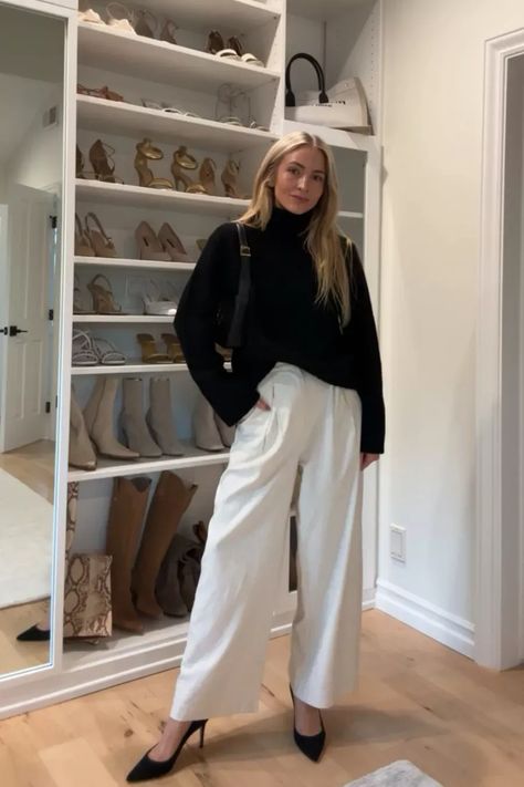 Repeating this chic black and white winter outfit all season 🖤 I styled this black cashmere turtleneck sweater with loose trousers and classic black heels. Tap to shop and bring this fashion inspo to life! Chic Turtleneck Outfit, White Turtleneck Outfit Work, Black Turtle Neck Sweater Outfit Women, White Turtle Neck Outfit Ideas, White Trousers Outfit Autumn, Cream V Neck Sweater Outfit, Trouser And Sweater Outfit, White Trouser Winter Outfit, Trousers And Heels Outfit Ideas