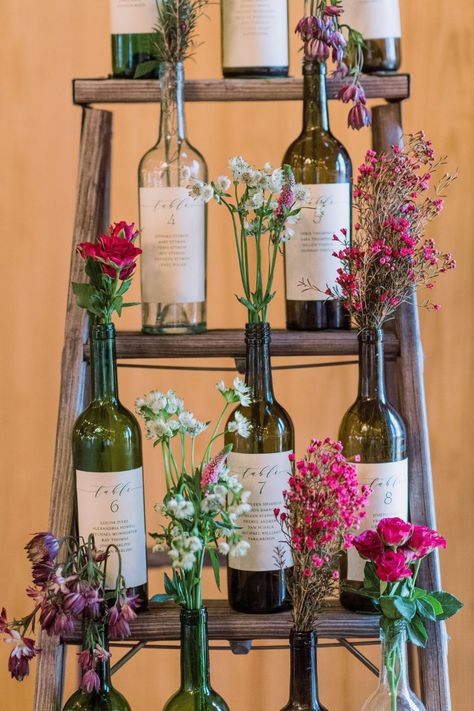 Wine Bottle Bud Vase Wedding, Decoration With Wine Bottles, Recycled Wine Bottles Wedding, Wedding Inspo Romantic Rustic, Wine Bottles As Vases, Display Wine Bottles, Plant In Wine Bottle, Wine Bottle With Flowers Centerpieces, Rustic Wine Bottle Centerpieces