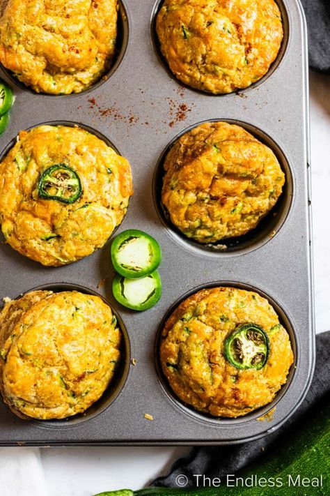 These zucchini cornbread muffins will take your dinner to the next level! They're moist, cheesy, and slightly sweet with a hint of heat from minced jalapeño. We serve them with homemade chili honey butter, and it's all ready in just 35 minutes! #theendlessmeal #cornbread #chili #snack #sidedish #zucchini #comfortfood #vegetarian #muffins Healthy Cornbread Muffins, Cornbread Breakfast, Vegetarian Muffins, Cornbread Chili, Zucchini Cornbread, Healthy Cornbread, Chili Honey, Jalapeño Cornbread, Cheesy Zucchini