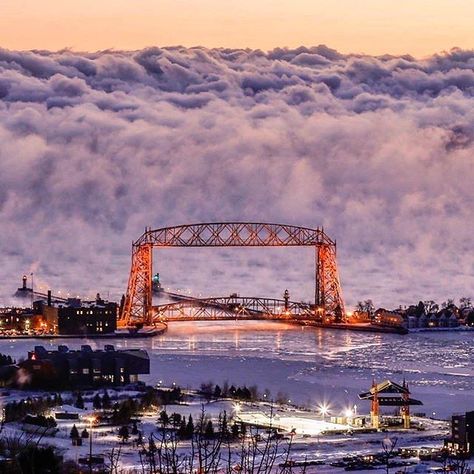 Amazing photo of sea smoke (fog) rising off of Lake Superior behind the Aerial Lift Bridge in Duluth, Minnesota, by (at)muddman4809 via Instagram. Lift Bridge, Minnesota Travel, Minnesota Home, Midwest Living, Duluth Minnesota, Duluth Mn, Michigan Travel, Amazing Photo, Natural Phenomena