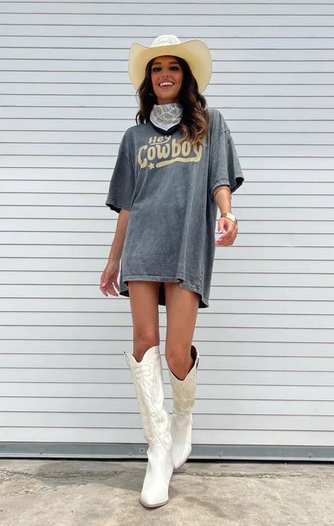 Rodeo Glamour: A Style Round-Up of Texas' Chicest Rodeo Outfits for Every Season Tshirt With Cowboy Boots Outfit, Country Concert Oversized Shirt Outfit, Country Tshirt Ideas Concert, Country T Shirt Dress Outfit, T Shirt Dress Outfit With Boots, Big Tshirt Cowboy Boots, Graphic Tee Cowboy Boots Outfit, T Shirt Cowboy Boots Outfit, Cowboy Boots Oversized Shirt