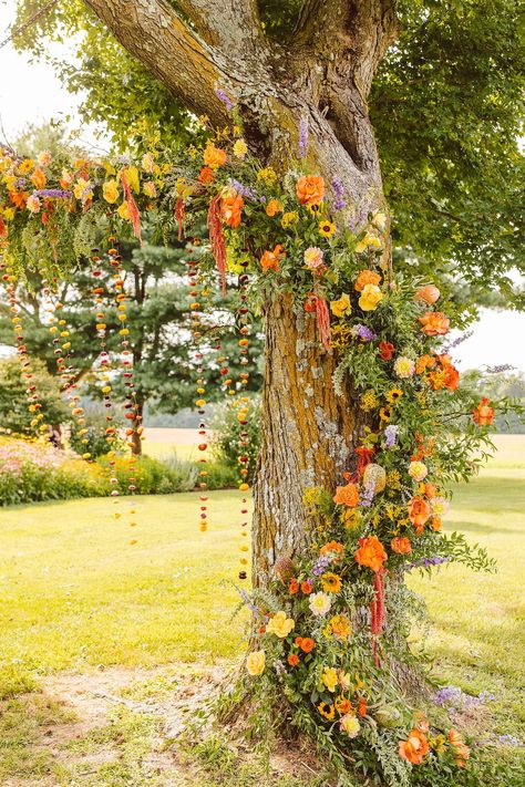 Colorful Boho Wedding Day Inspiration | Brooke Michelle Photo | Charlotte Wedding Photographer | wedding photographer, orange wedding palette, outdoor wedding, floral installation, flowers in tree | via brookemichellephoto.com Orange Tree Wedding, Lavender Orange Green Wedding, Orange Orchard Wedding, Outdoor Wedding Tree Decor, Summer Wedding Aisle Decor, Boho Wedding Arches, Eclectic Wedding Arch, Gazebo Flowers Wedding, Marigold Wedding Colors