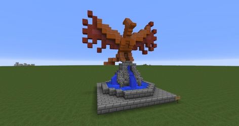 Phoenix fountain (with tutorial) Minecraft Map Minecraft Phoenix Statue, Minecraft Eagle Statue, Minecraft Bird Statue, Minecraft Statues Blueprints, Fountain With Statue, Minecraft Statue Ideas, Statue Minecraft, Minecraft Statue, Minecraft Fountain