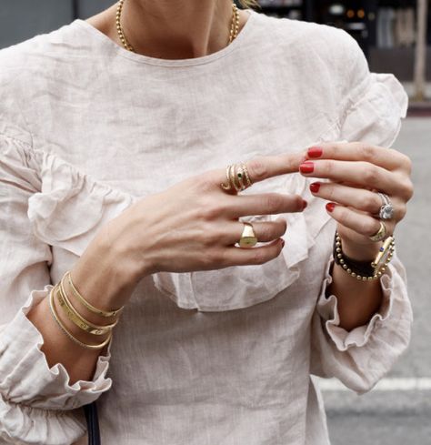 layering jewelry, minimalist jewelry, ruffle top, red nails, classic watch, signet ring Mode Tips, Farrah Fawcett, Classic Watches, Layered Jewelry, Looks Chic, Signet Ring, Minimalist Jewelry, Red Nails, White Shirt