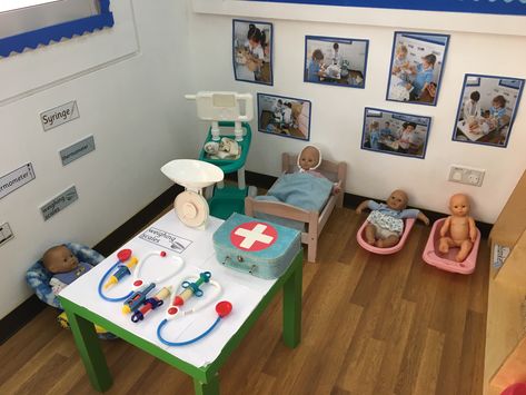 Baby clinic role play area Doctor Role Play Eyfs, Doctor Role Play Ideas, Doctors Role Play Area, Doctors Surgery Role Play Eyfs, Doctors Role Play, Doctor Play Area For Kids, Doctors Role Play Area Eyfs, Preschool Role Play Ideas, Hospital Role Play Area Eyfs