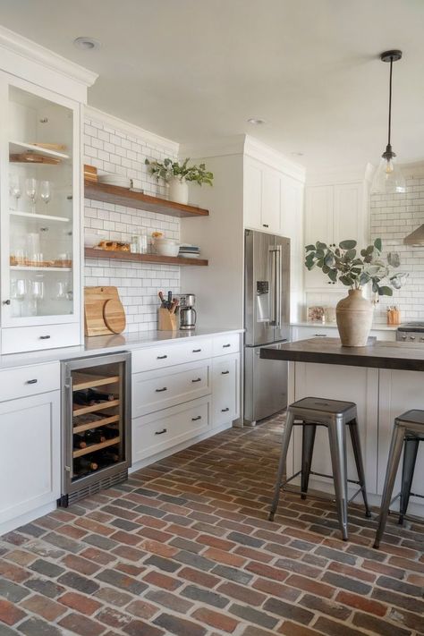 A kitchen with green cabinets and a brick kitchen floor that complements the rustic wooden ceiling. Brick Kitchen Floors, Brick Kitchen Floor, Brick Floor Kitchen, Kitchen Flooring Ideas, Brick Floor, Kitchen Floors, Brick Kitchen, Brick Pavers, Brick Flooring