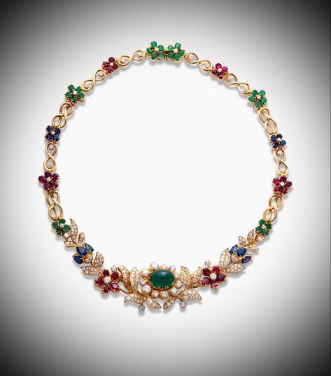 Alexandre REZA. EMERALD, RUBY, SAPPHIRE AND DIAMOND NECKLACE. 1 oval cabochon emerald, 10 oval-shaped rubies, 6 pear-shaped sapphires, 28 circular-cut emeralds, 18 rubies, 8 sapphires and diamonds. Price Realised CHF 20,000 // Estimate CHF 8,500-CHF 13,000. Signed A.REZA. French mark, maker's mark, OR 18K (750). Length: 37,0 cm. Gross weight: 74 gr. [C. GE. MAY 2021] #AlexandreREZA #Ruby #Emerald #Sapphire #Diamond #Fine jewelry Ruby Diamond Necklace, Bridal Jewellery Design, Diamond Jewelry Necklace, Ruby Emerald, Ruby Necklace, Girly Art Illustrations, Ruby Sapphire, Gemstone Jewellery, Ruby Diamond