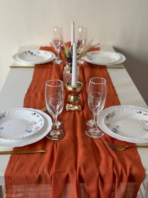 Rust terracotta boho table runner is a decorative fabric piece that is placed on a table to add a rustic, nature-inspired touch to wedding decor. MATERIAL: 100% Cheesecloth gauze runner The size - the width of the runner is 35 inches (90 cm) . Select the desired length or apply for an individual order. NOTE - Hand wash only 30;  No ironing required to maintain wrinkled texture;  No dry cleaning ATTENTION! Due to the handmade process of dyeing, some imperfections, pigment marks, and color variati Terracotta Centerpieces, Boho Wedding Party, Centerpieces For Wedding, Boho Table Runner, Wedding Party Decor, Boho Style Wedding, Wedding Elegant, Aisle Runner, Table Setup