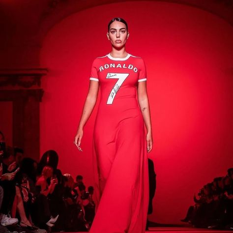 Cristiano Ronaldo’s wife, Georgina Rodriguez, made a significant appearance at Paris Fashion Week, walking for Vetements in a red dress that merged football jersey elements with an elegant pleated train skirt, reflecting her bond with the football legend. This event marked Vetements’ decade in the industry, attracting widespread attention and featuring a range of oversized and distinctively styled pieces​​. Photos: @vetements_official #gclasslife #carswithclass #luxlife #luxurylifestyle #B... Train Skirt, Georgina Rodriguez, G Class, Football Jersey, Football Jerseys, Cristiano Ronaldo, Luxury Lifestyle, Ronaldo, Paris Fashion