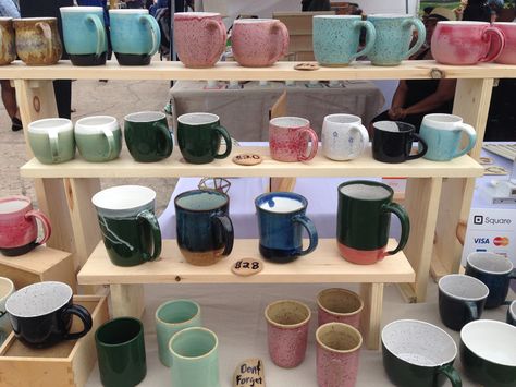 Mugs displayed on newly constructed shelves.  The rain didn't dampen our spirits! Mug Stand Display, How To Display Mugs At A Craft Fair, Craft Fair Mug Display, Mug Display Ideas Craft Show, Cup Display Ideas Craft Fairs, Pottery Booth Display, Convention Display, Market Stall Display, Art Fair Booth