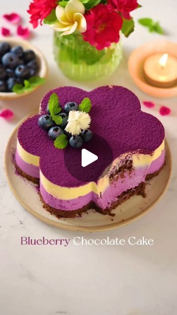 Ali BOUTOUNNOU 💚 on Instagram: "YAY or NAY?❤️ Eggless Blueberry Chocolate Cake A Summer Delight🥰 Follow me for more deliciousness 😋 so beautiful 😍Indulge in the vibrant colors and delectable flavors of this Eggless Blueberry Chocolate Cake! 🌸 This one-bowl wonder combines a rich chocolate sponge with a generous dusting of blueberry powder, topped off with a charming flower-shaped cake at its heart. Perfectly balanced and irresistibly delicious, it's the ultimate summer dessert! 🍫🫐 By @passionateaboutbaking ❤️ what do you think 🤔

⭐ Join me at @pastry_creation_1 for a journey into healthy and straightforward Vegan recipes 🥰

⭐ Know someone who'd adore these recipes? Tag a friend and share the goodness!🥰

⭐ For the recipe link check out my broadcast channel VEGAN LOVE in the bio ❤️ Blueberry Chocolate Cake, Blueberry Powder, Blueberry Chocolate, Shaped Cake, Chocolate Sponge, Yay Or Nay, Summer Dessert, Summer Desserts, Tag A Friend