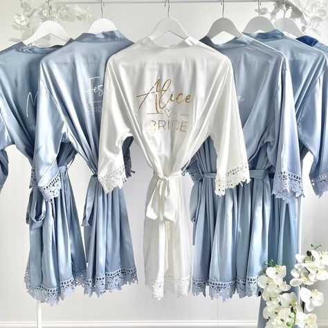 Our personalised satin robes are perfect for the Bridal Party the morning of your wedding. The Glamorous morning of the wedding robes are soft to the touch and have beautiful decorative lace piping. We have a wide range of colours to choose from, select your colour and then we hand personalise with your role and name on the back of the robe in either white, black, gold , rose gold or silver. If you would prefer a different colour please send me a message and this can be arranged. HOW TO ORDER: Blue Bridesmaid Robes, Bridesmaid Robes Blue, Morning Of The Wedding, Wedding Dressing, Bridesmaids Robes, Matching Bridesmaids, Proposal Boxes, Wedding Robes, Satin Robes