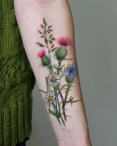 35 Beautiful Nature Tattoo Ideas And Designs To Inspire Wildflower And Barley Tattoo, Wildflower Bouquet Tattoo, Daschund Tattoo, Thistle Flower Tattoo, Moms Tattoo, Small Nature Tattoo, Nature Tattoo Ideas, Thistle Tattoo, Flower Bouquet Tattoo