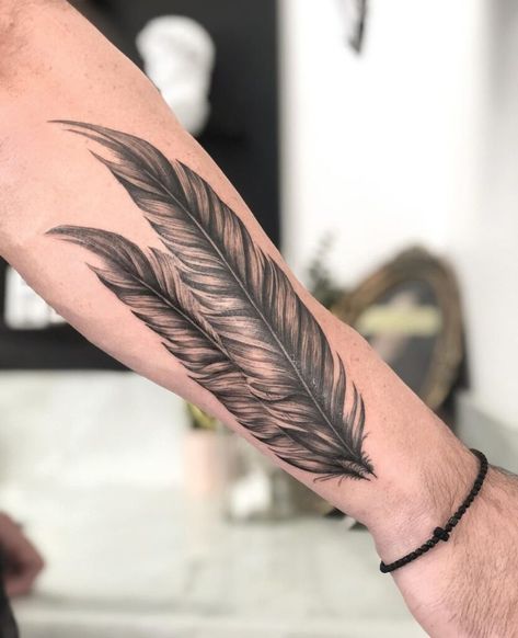 Spread Your Wings And Embrace Free Spirit With 25 Feather Tattoo Ideas Eagle Feather Tattoo Native American, Forearm Feather Tattoo, Raven Feather Tattoo, Feather Tattoo Men, Eagle Feather Tattoo, Native American Feather Tattoo, Feather Tattoo Ideas, Feather Tat, Phoenix Feather Tattoos