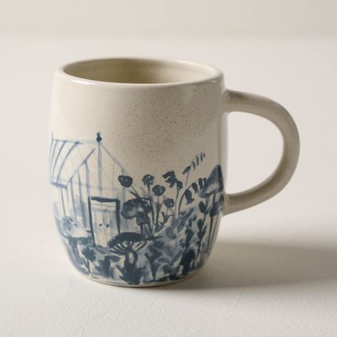 Inspired by one of Jo's favorite mugs, our greenhouse mug is just right for sipping a morning cup of coffee on the front porch. Painted in-house and finished with a speckled glaze, this mug features a watercolor scene reminiscent of Jo's garden. Pretty Coffee Mugs, Cottage Core Ceramics, Magnolia Greenhouse, Ceramic Pottery Painting Ideas, Watercolor Ceramics, Carved Mug, Magnolia Kitchen, Morning Cup Of Coffee, Ceramics Glaze