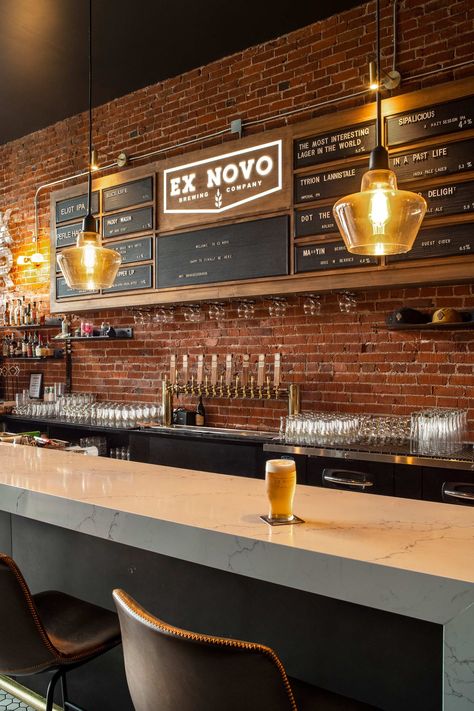 Ex Novo Brewing Company, a Portland-based brewery, found their second location in the heart of Old Town Beaverton in the historic Cady Building, right in the city’s emerging “restaurant row.” SEA’s design uses thoughtful historic preservation and customized interiors to breathe new life into the building and deliver a brewpub experience that allows patrons to step back in time. #architecture #restauarantdesign #bardesign #brewerydesign #historicpreservation #beavertonor #brewpubdesign Brewery Design Interior, Brewery Bar Design, Brewery Interior Design, Beer Bar Design, Taproom Ideas, Hospitality Architecture, Time Architecture, Brewery Interior, Lounge Vibes