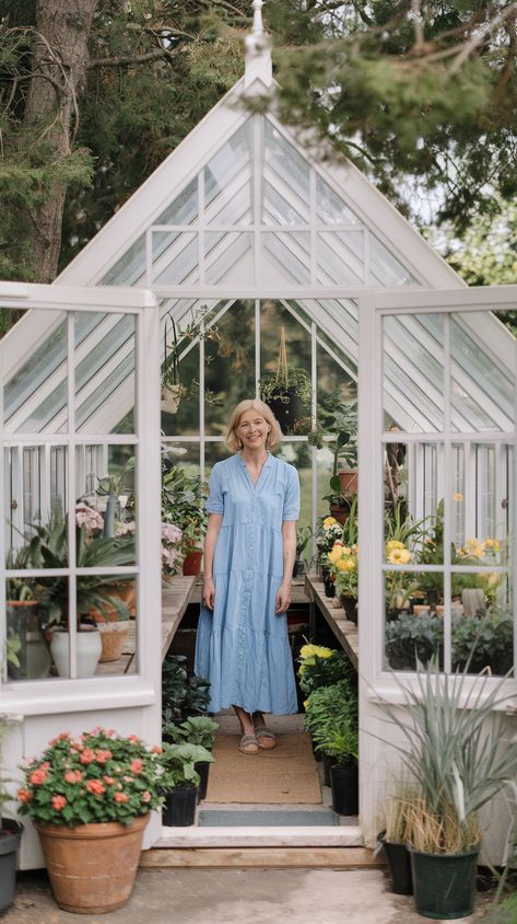 recycled window greenhouse and a lady standing inside Diy Glass Greenhouse Recycled Windows, How To Greenhouse, Easy Greenhouse Diy, Greenhouse Building Plans, How To Build A Greenhouse, Reclaimed Window Greenhouse, Greenhouse From Old Windows Diy, Window Greenhouse Diy, Shed And Greenhouse Combo