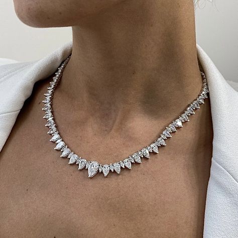 This stunning 14k white gold necklace features a dazzling array of 33.13 carats of certified marquise and pear cut diamonds. The intricate setting and the perfect balance of shapes create a captivating piece that will turn heads. Whether you're dressing up for a special occasion or simply adding a touch of glamour to your everyday look,  Its timeless design and exceptional craftsmanship make it a versatile and enduring piece that you'll cherish for years to come. Diamond Tennis Necklace, White Gold Necklace, White Gold Set, Pear Cut Diamond, Luxury Necklace, Elegant Necklace, Tennis Necklace, Pear Shaped Diamond, Elegant Necklaces