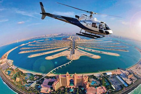 Private Helicopter Tour is an adventurous activity in Dubai Though it can be a bit pricey, it is worth it for sure Here’s all you need to know about it. Best Helicopter, Dubai Activities, Dubai Safari, Dubai Tour, Dubai Desert, Helicopter Ride, Burj Al Arab, Palm Jumeirah, Dubai City