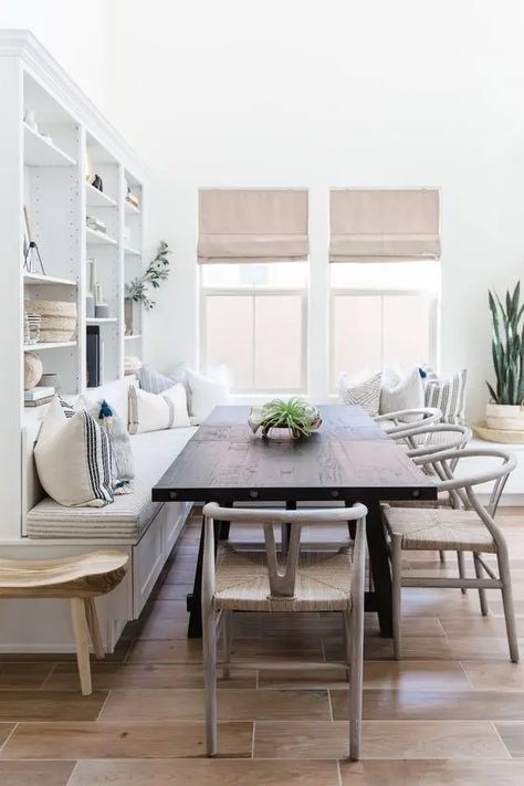 a welcoming neutral dining space with a built in bench, a dark stained table, woven chairs and cool shades is very welcoming Seating In Kitchen, Dining Room Banquette, Amazing Interiors, Banquette Seating In Kitchen, Dining Room Bench Seating, Kitchen Banquette, Nook Ideas, Kitchen Seating, Dining Room Seating