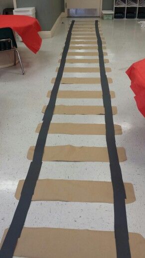 Polar Express Christmas Party Lds, Diy Train Tracks On Floor, Polar Express Fundraiser, Polar Bear Express Decorations, Train Ideas For Preschool, Polar Express Day Decorations, Polar Express Cupcakes, Polar Express Trunk Or Treat Ideas, Polar Express Cardboard Train Boxes