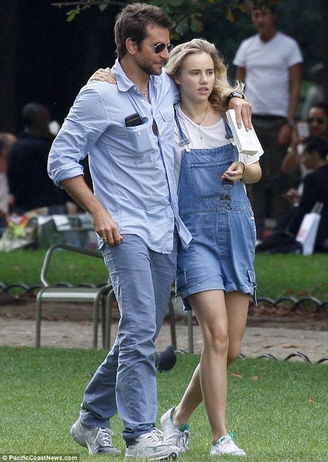 Bradley Cooper struggles to read his book as Suki Waterhouse sprawls across him in Parisian park Relationship Timeline, Hollywood Couples, Glen Powell, Suki Waterhouse, Celebrity Sightings, Double Denim, Bradley Cooper, Gala Dresses, Celebrity Entertainment