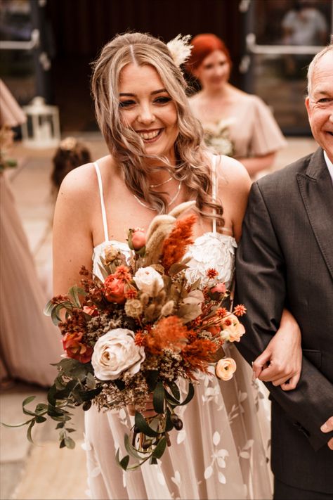 silk and dried bridal bouquet - featuring rust and terracotta pampas and dried flowers dried limonium - orange bunny tails faux olive foliage - silk hydrangea- silk roses - penny johnson flowers - photographs by stewart walker photography Rust Dried Flower Bouquet, Rust Bridal Bouquet, Terracotta Wedding Bouquet, Terracotta Bridal Bouquet, Rust Bouquet, Rust And Terracotta, Terracotta Bouquet, Dried Bridal Bouquet, Olive Foliage