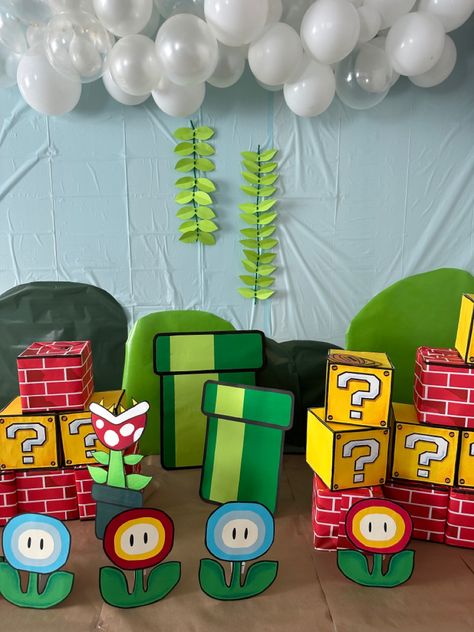 Super Mario World Decorations, Super Mario Theme Birthday Party, Super Mario Bros Halloween Decorations, Mario Theme Decorations, Diy Mario Backdrop, Super Mario Classroom Decorations, Mario Bros Office Decorations, Mario And Luigi Decorations, Mario Tunnel Diy