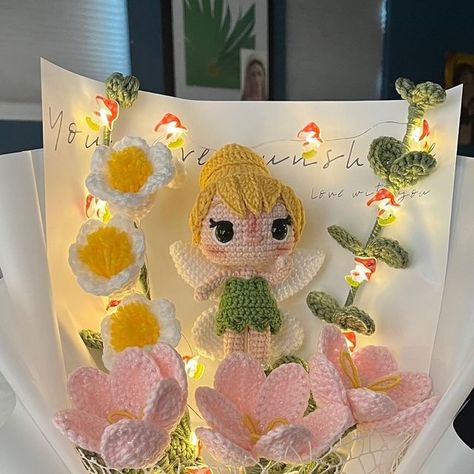 yuritza on Instagram: "a little bit of pixie dust ✨ can heal anything ❤️‍🩹  Happy 1st of July! I hope this month is full of happy memories for everyone 🥰 restock coming July 9th! I am very excited to show you everything!!   #tinkerbell #fairy #fairycore #bouquet #crochet #crochetbouquet #crochetlove #crochetflowers #crochetflower #crochetflowerbouquet #smallbusiness #heal #fairylights" Fairycore Bouquet, Crochet Tinkerbell, Bouquet Crochet, Tinkerbell Fairy, Mini Cakes Birthday, Crochet Bouquet, July 9th, Pixie Dust, Happy Memories