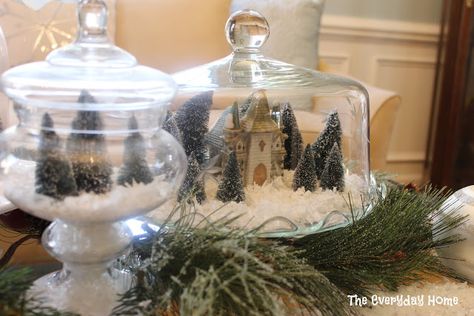 What a clever way to display your village keepsakes! Via The Everyday Home. #Christmas #decor Cake Stand Decor, Crystal Cake, Mini Houses, Tree Centerpieces, Dessert Aux Fruits, Glitter Houses, Snow Village, Plate Decor, Cake Cover