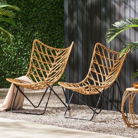 Our 2-piece Patio Accent Chairs set features a wicker finish that provides an earthy boho look for any patio or backyard space. Featuring graceful curves contrasted by clean lines, this set maintains a comfortable and reliable design. Each chair is finished with a geometric cross base, making this modern aesthetic ideal for any style of decor. This isn't merely a chair - it's an open invitation to unwind, reminisce, and create lasting memories under the open sky. Patio Furniture Sets Wicker, All Modern Patio Furniture, Hanging Patio Chair, Bamboo Patio Furniture, Tulum Patio Decor, Small Outdoor Patio Furniture, Boho Porch Decor Outdoor, Boho Wicker Chair, Outdoor Boho Decor