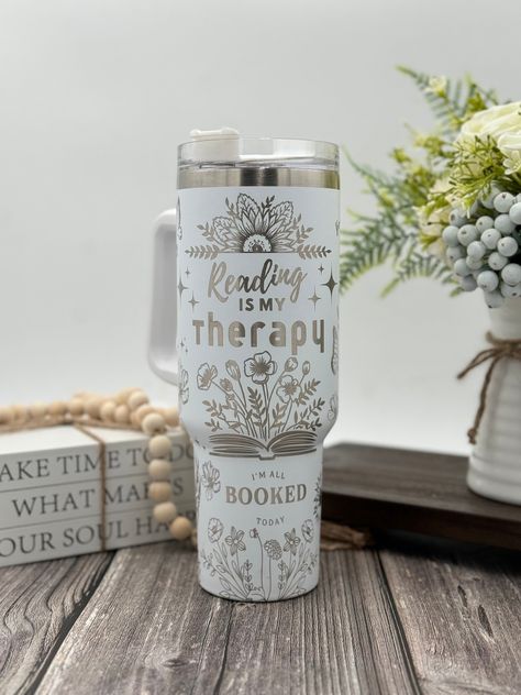 Indulge in the soothing embrace of literature with our enchanting Laser Engraved Tumbler adorned with the heartfelt message "Reading is my therapy" surrounded by a delightful array of books. This isn't just a tumbler; it's a sanctuary for book lovers, expertly laser-engraved with the comforting presence of beloved stories and the timeless wisdom they impart. Key Features: 📚 Literary Sanctuary: Immerse yourself in the world of words with our tumbler's enchanting design, where books of all shapes Laser Crafts, Engraved Yeti, Large Water Bottle, Laser Engraved Ideas, Engraved Tumbler, Tumbler Ideas, Custom Cups, Alien Art, Book Worm